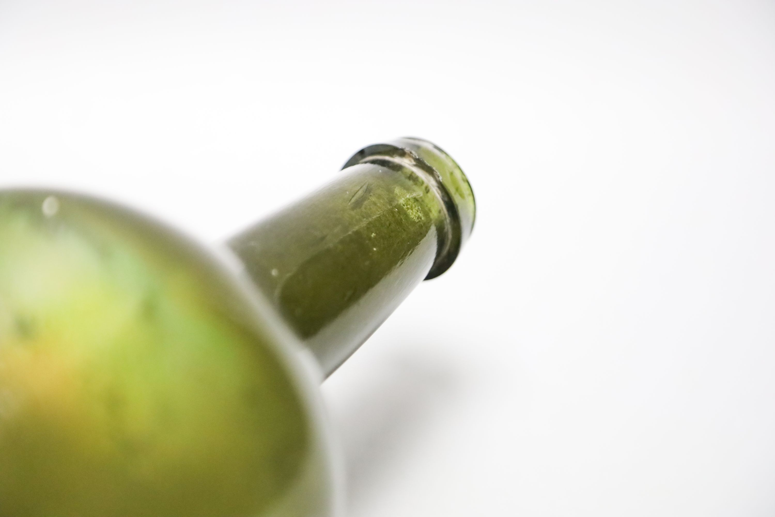 A George III green glass sealed wine bottle, dated 1778 26cm